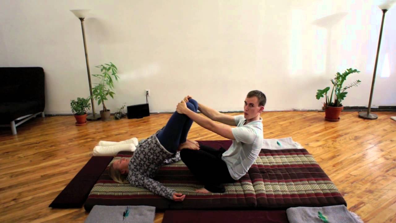 Relaxing and lengthening out the low back in Thai massage