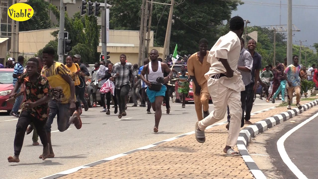 WATCH!!!! Tension As Hoodlums Hijack Protest In Abuja