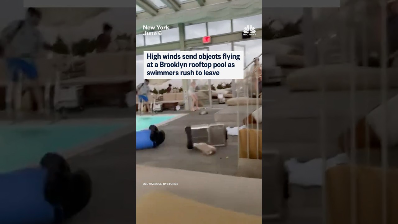 High winds send objects flying at a Brooklyn rooftop pool as swimmers rush to leave
