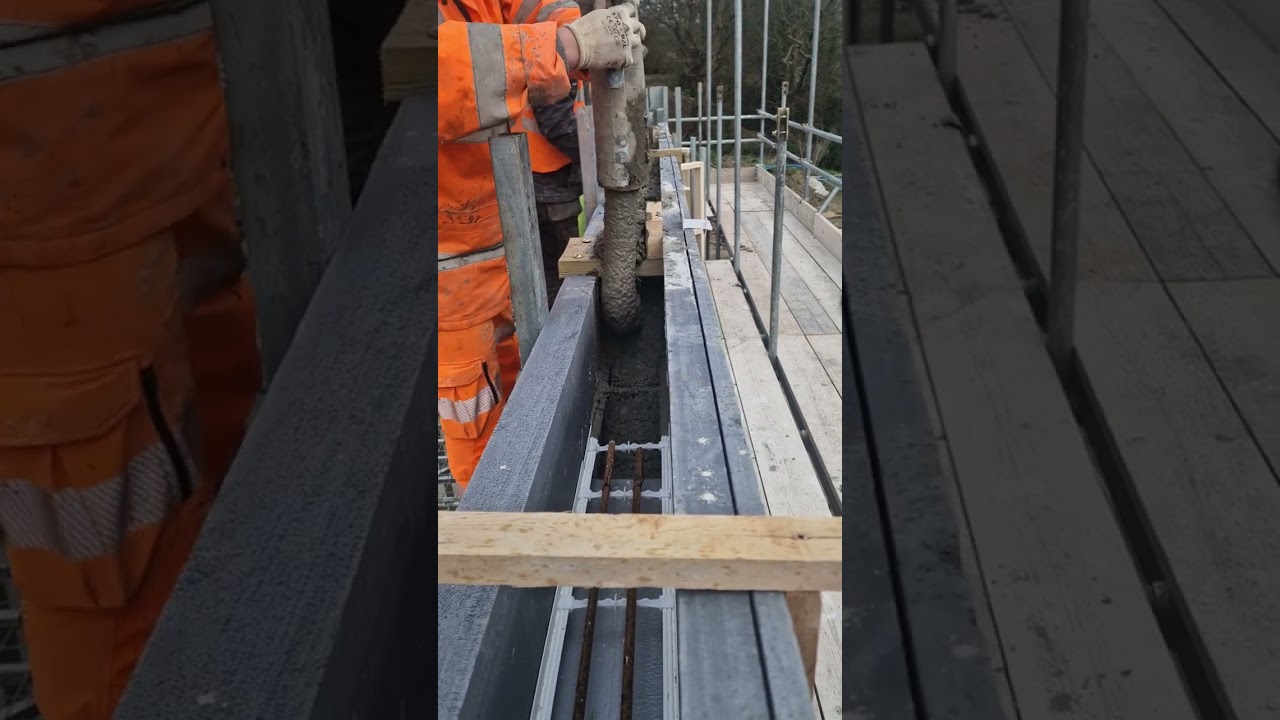 Pouring concrete into R-WALL