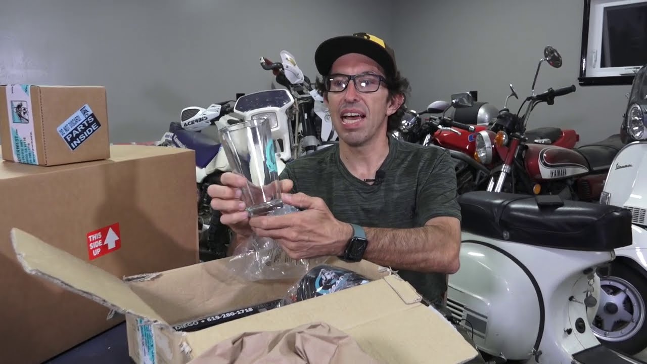 Robot Unboxes Some Goodies from Scooterwest.com!