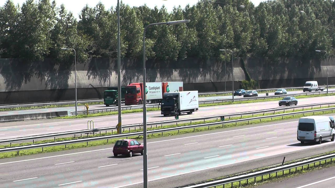 trucks and traffic,  highway A15, near Rotterdam, NL, 27 augustus 2014