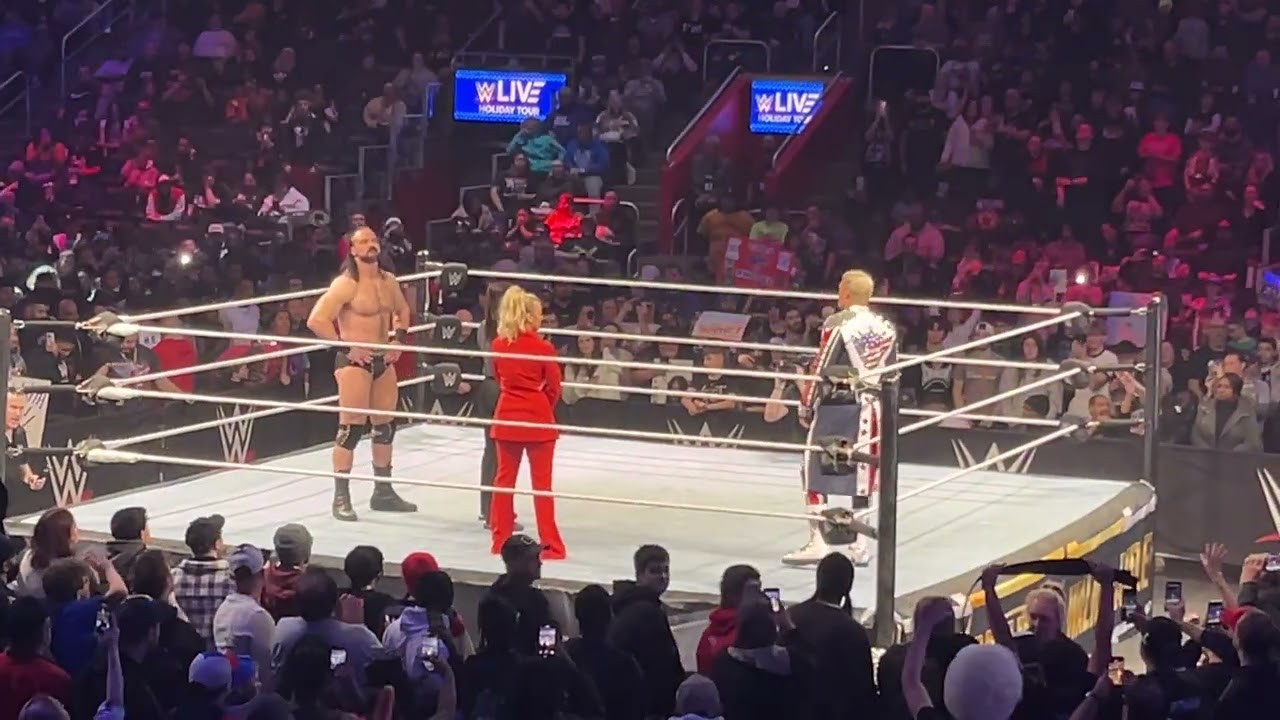 Reece, Brooks, and Chase watch a Detroit Street Fight between Cody Rhodes and Drew McIntyre