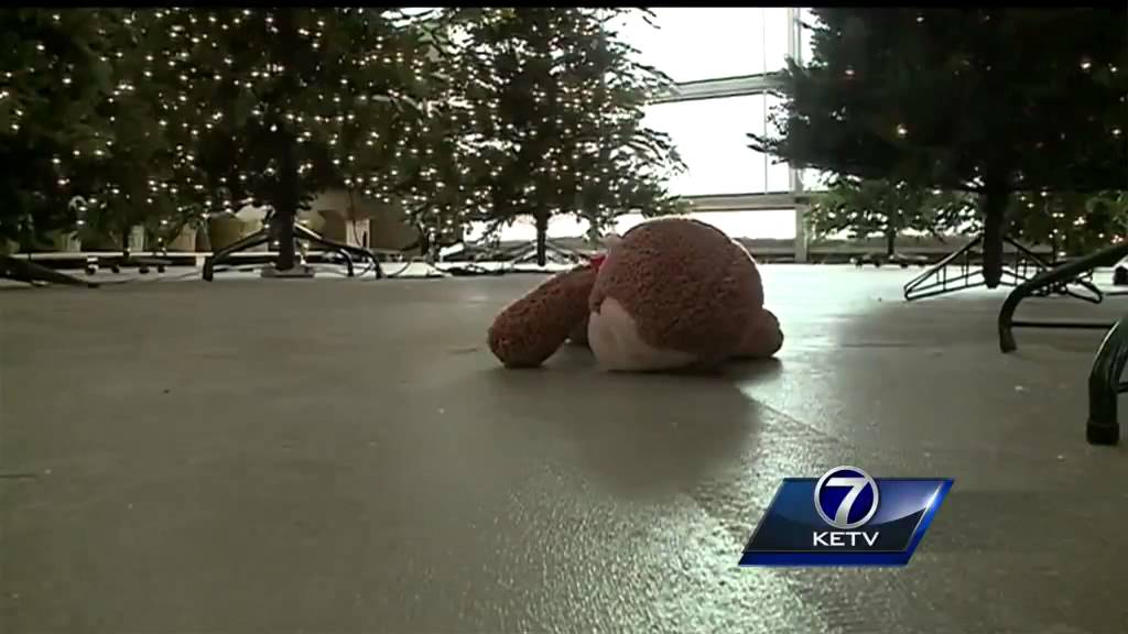 Omaha business launches search for owner of Curious George toy