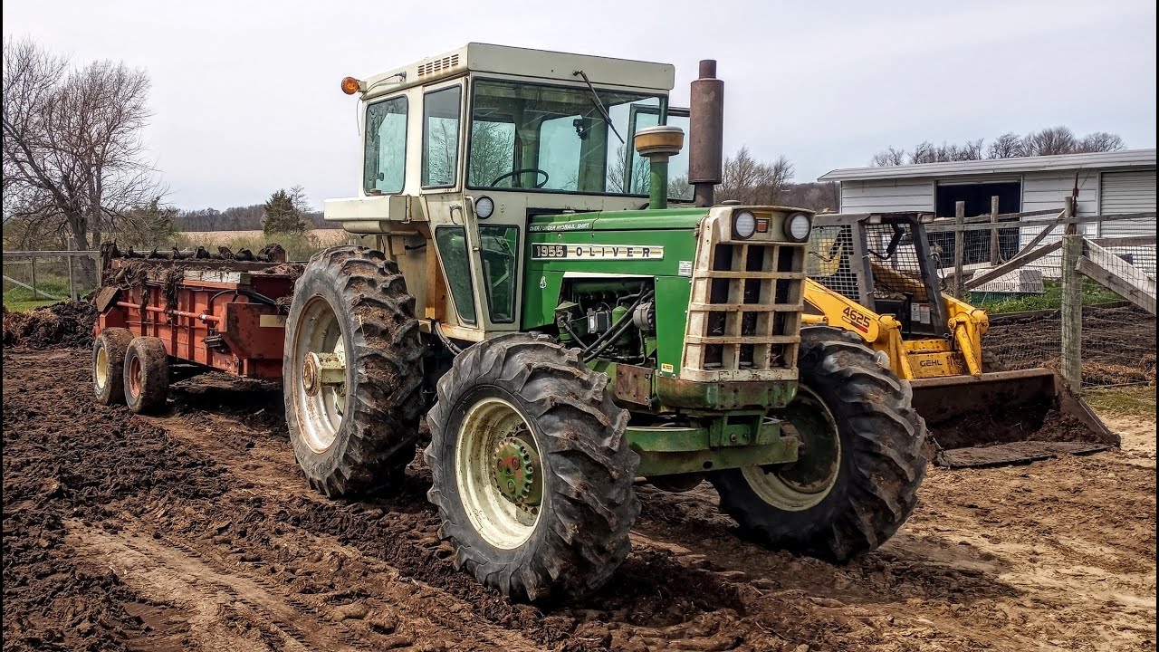 Oliver 1955 FWA returning used hay to the earth.