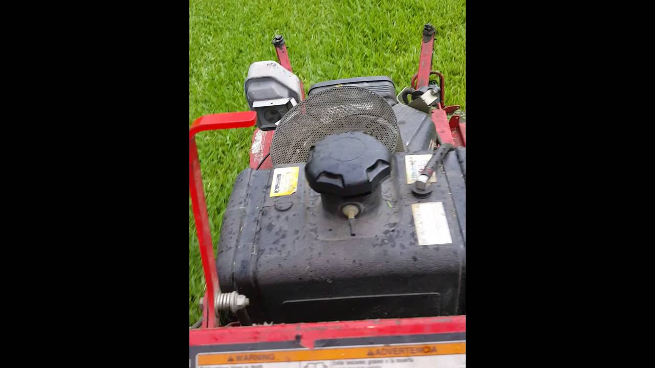 Belt drive mowing in wet grass in the rain