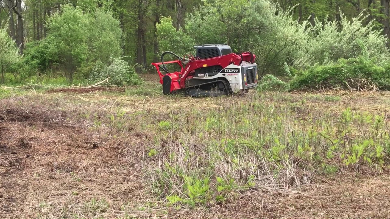 Takeuchi TL12V2 with an AHWI M450h-1900 mulcher