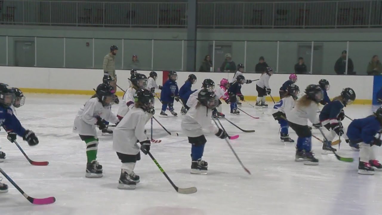 Young girls sliding into their dreams in Northford with the New York Rangers Hockey Team