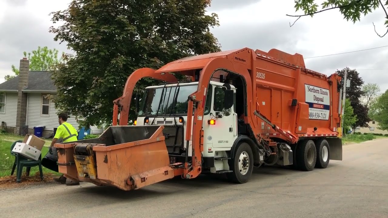 Autocar McNeilus Meridian Carry Can Garbage Truck Moving Fast