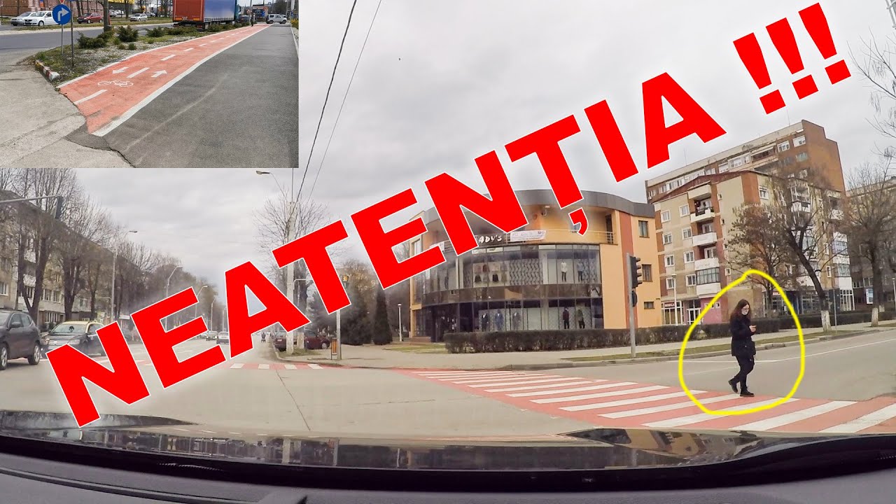 PIETONI CARE TRAVERSEAZA STRADA NEATENTI SI BICICLISTI IN TRAFIC