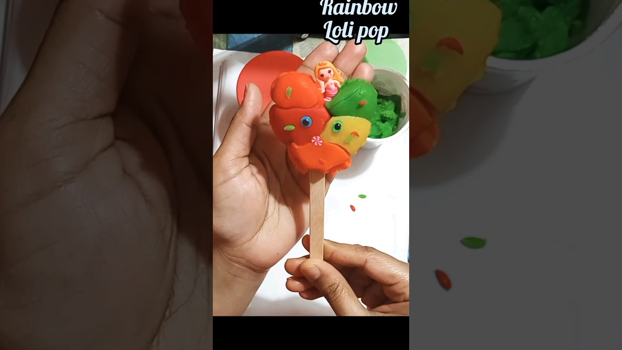 making a rainbow heart Loli pop with Play-Doh...