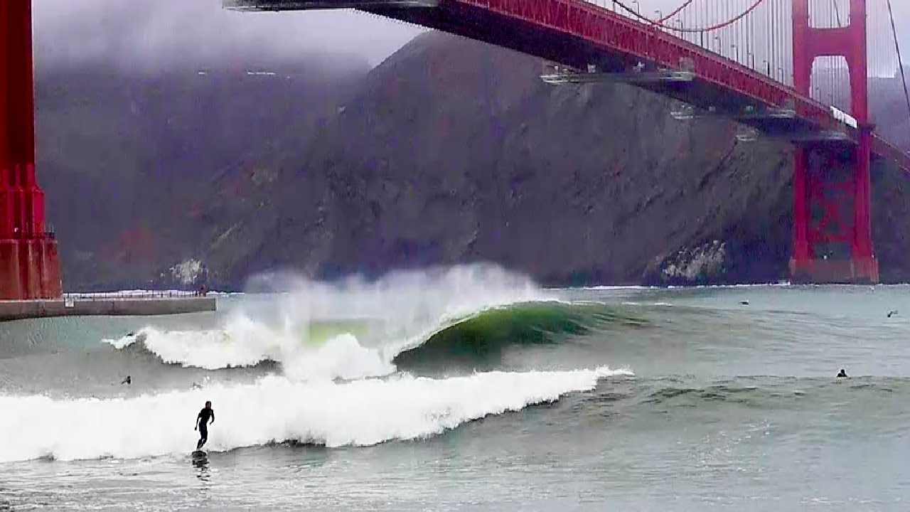 SURFING under the GOLDEN GATE BRIDGE! (2021 winter swell at Fort Point, San Francisco)