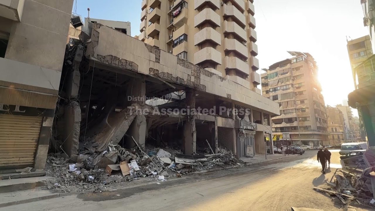 Excavators clear debris after Israeli strike in Haret Hreik area of Beirut's southern suburbs