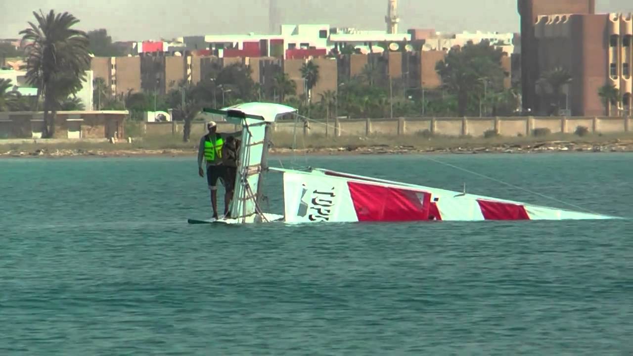 Catamaran TopCat K1. Capsizing and lifting