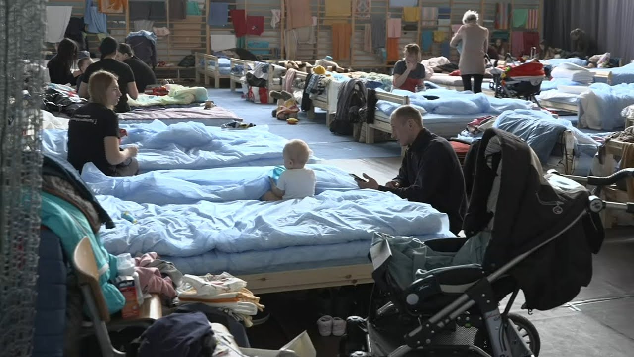 Refugees from Ukraine rest in a shelter after entering Poland | AFP