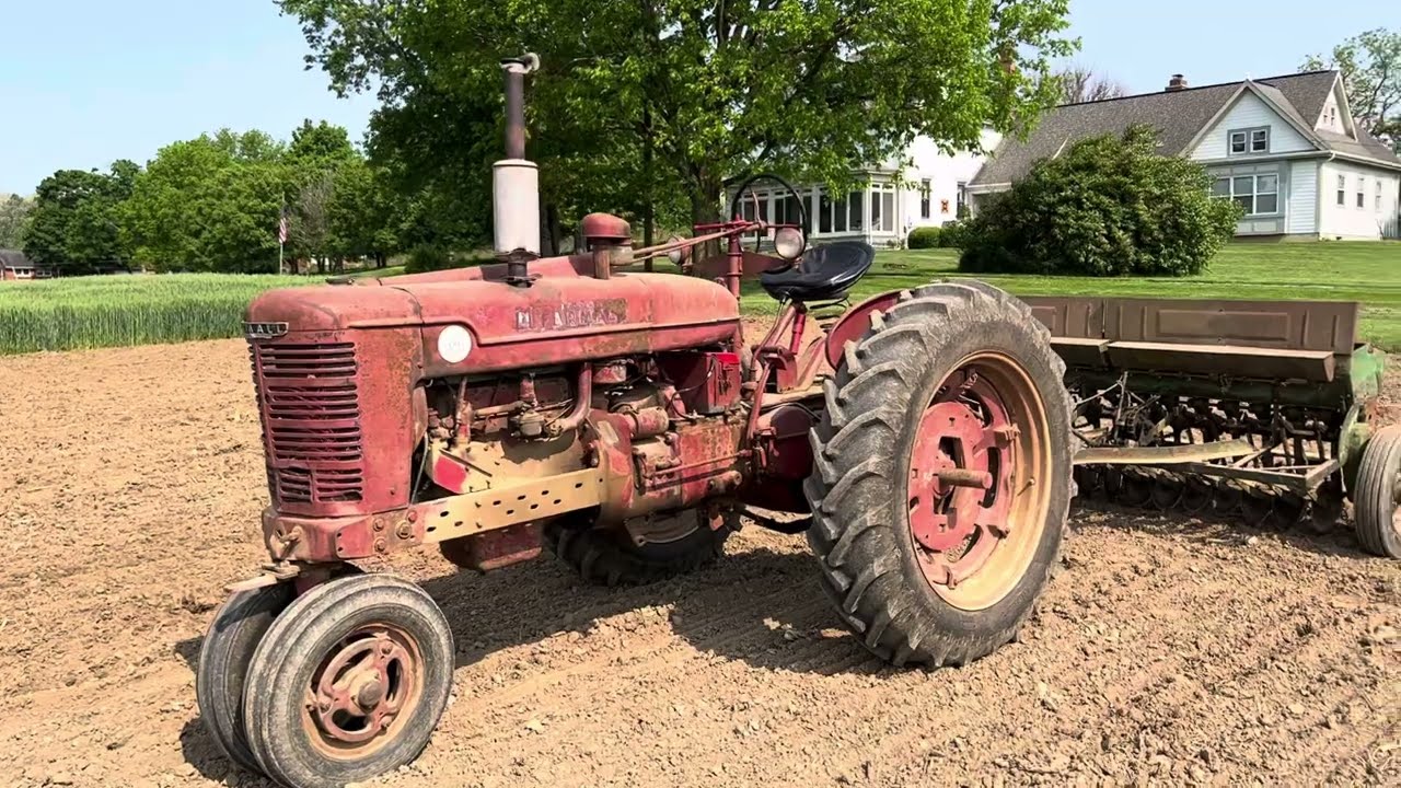 Farmall M Tractor and John Deere Van Brunt Drill