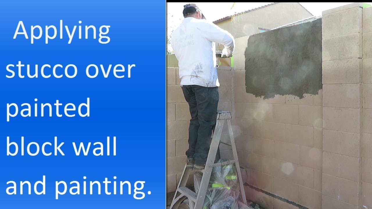 Applying stucco over painted block wall.