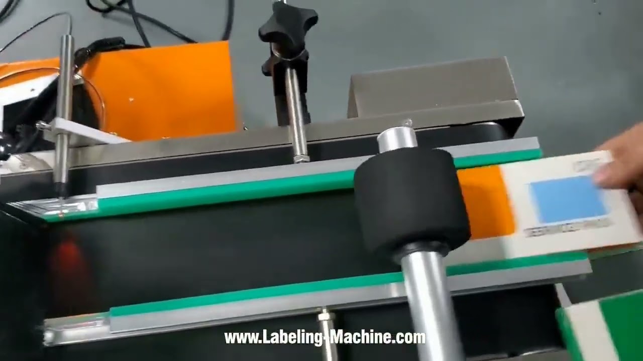 Tabletop carton box case top side automatic labeling machine label applicator video