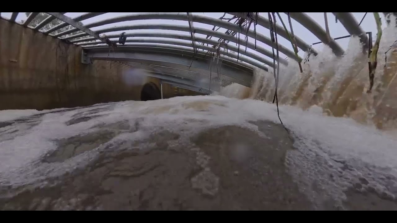 Wetlands overflowing into this drain on a rainy day.