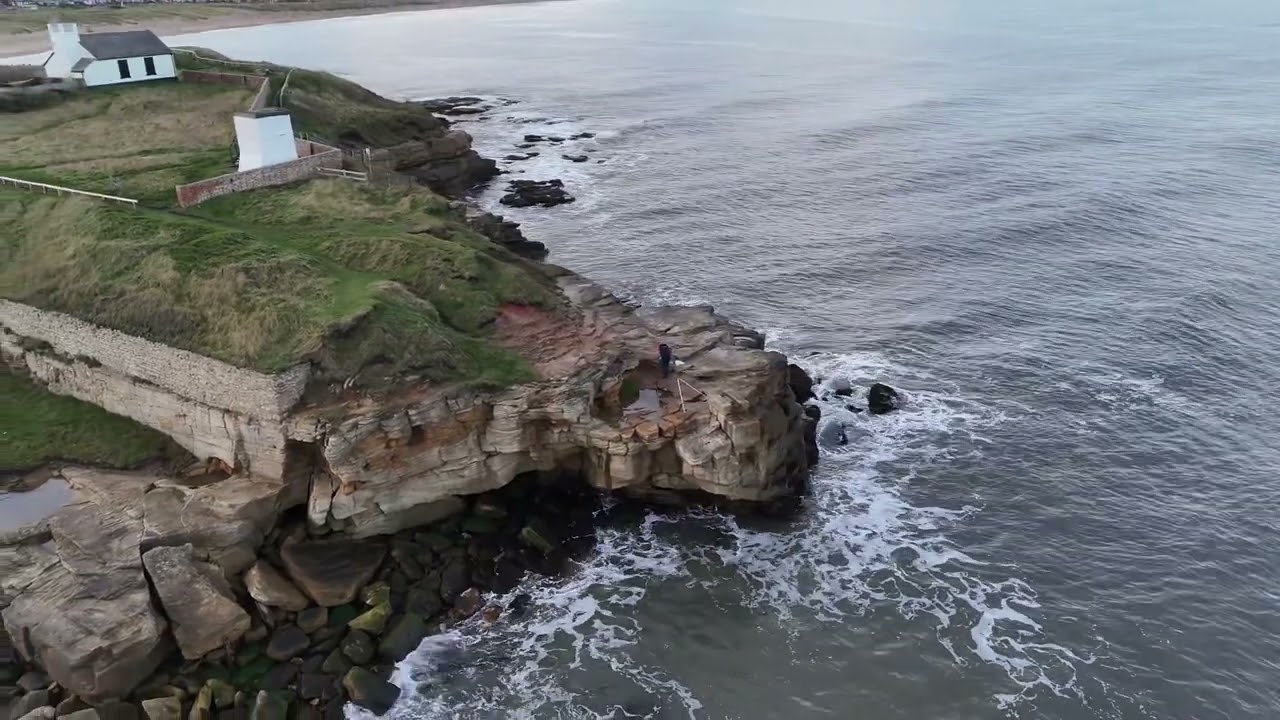 Rocky island Lone angler & another 2 at the end on cliffs. Enjoy 😊 