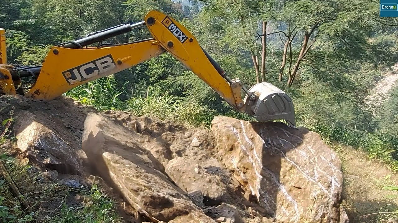 Struggle to Dig out this Massive Stone-Constructing New Mountain Road-JCB Backhoe