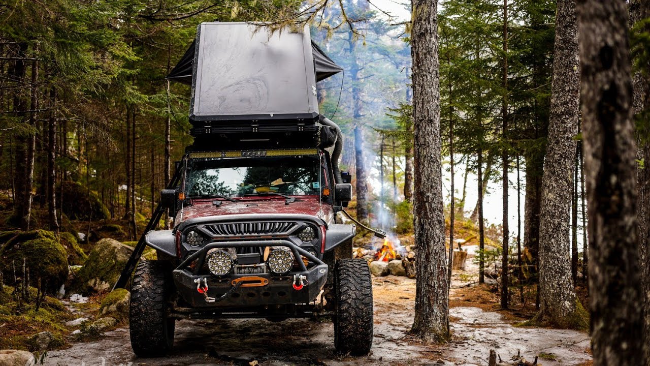 Overland Jeep Camping With Rooftop Tent Deep In The Forest