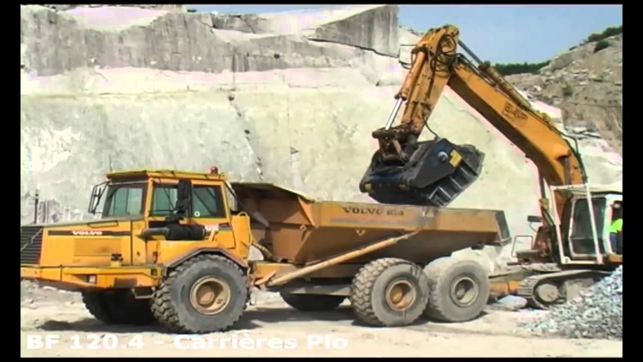 MB Crusher bucket BF 120.4 cruhing granite in a big quarry