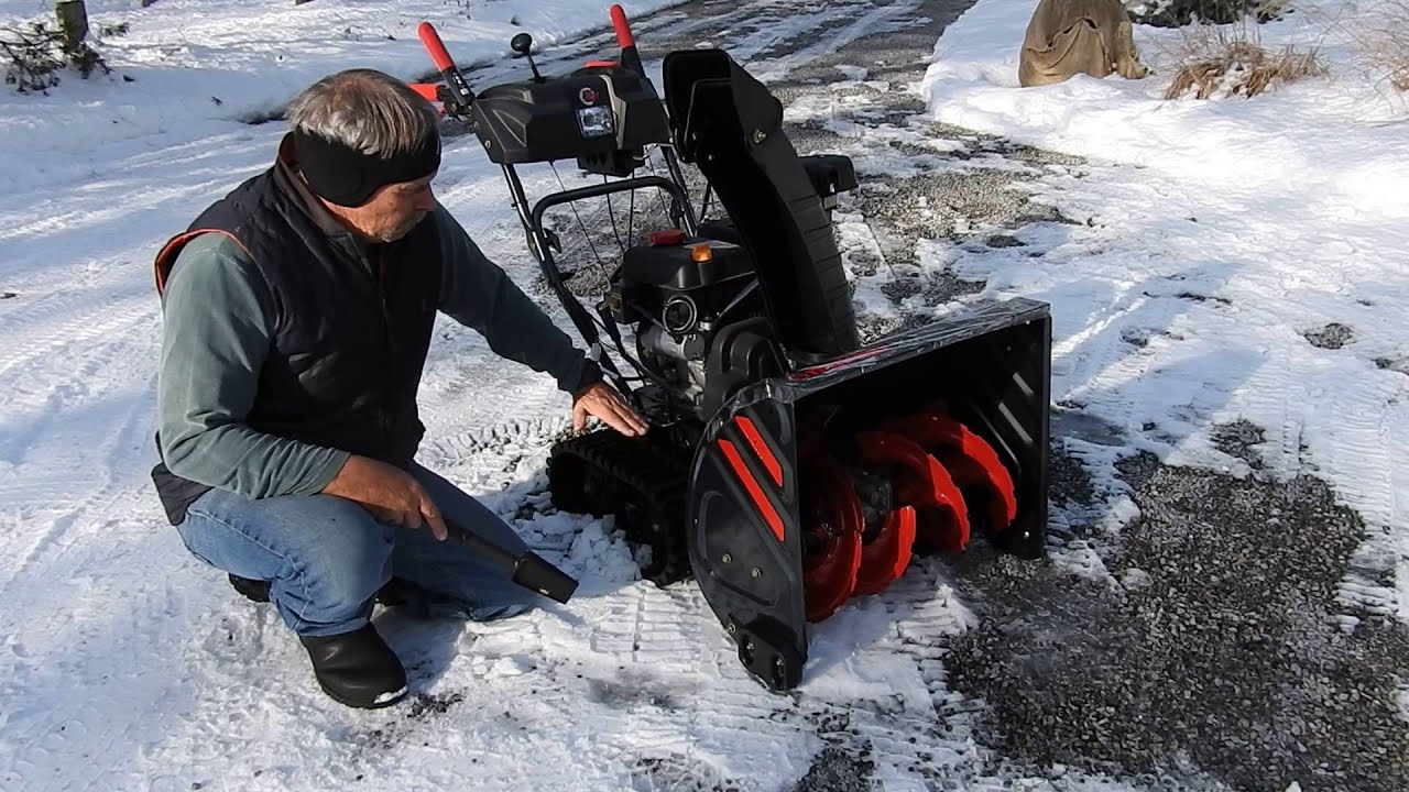 SNOWBLOWER ON A GRAVEL DRIVEWAY