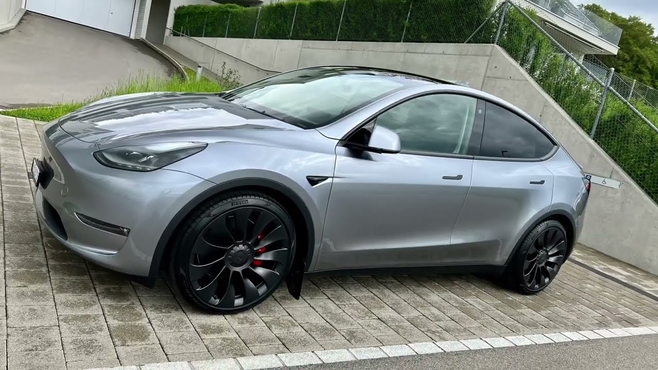 Tesla Model Y Performance Quicksilver under a cloudy sky [4K - HDR]