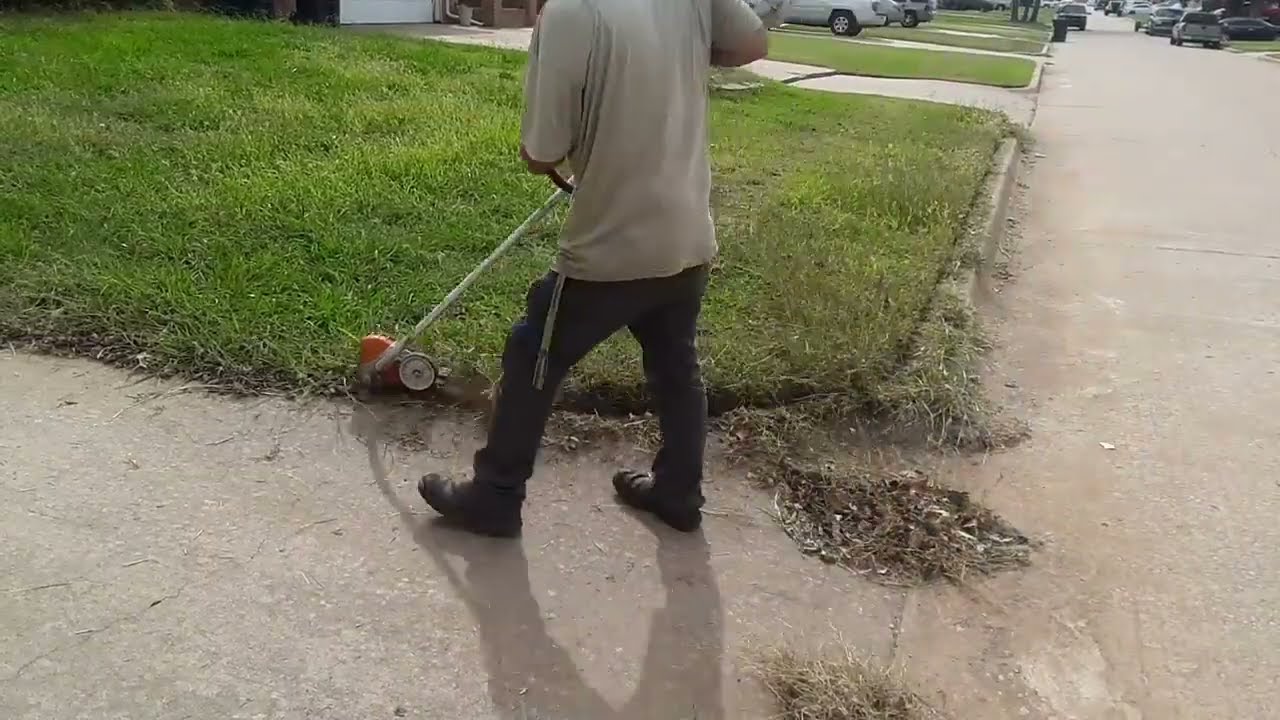 First overgrown lawn cleanup this year, multiple city violation paperwork on door