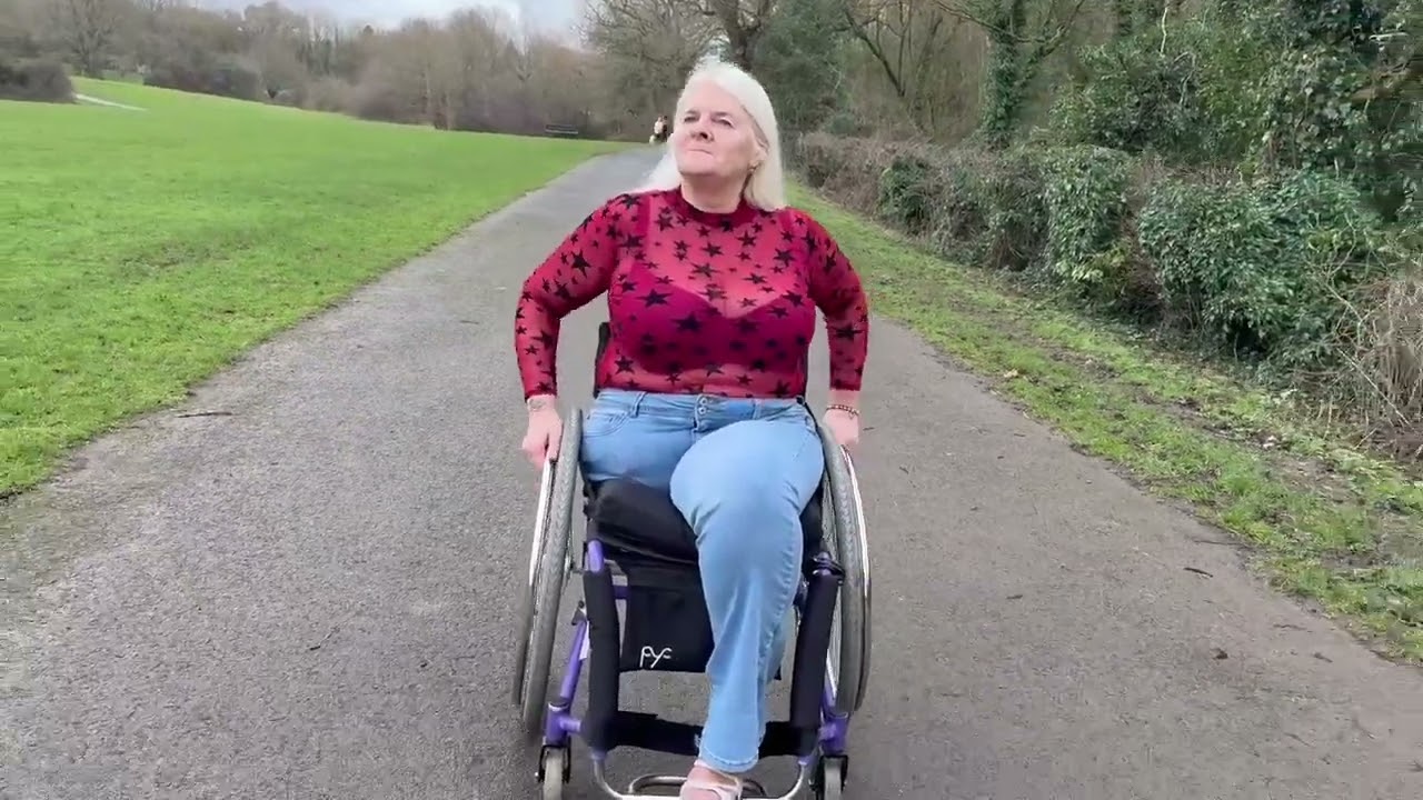 Amputee Alecia Wheelchair Stroll In the park