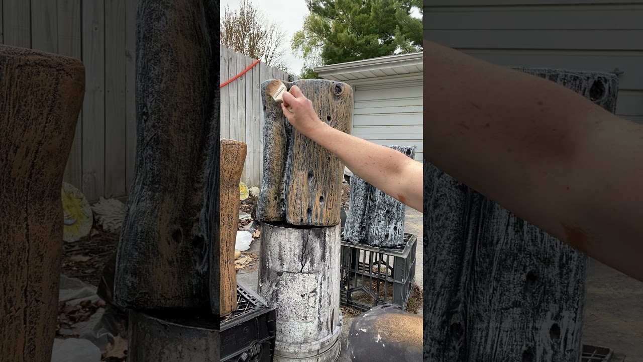 Painting concrete tree stumps to look like real wood