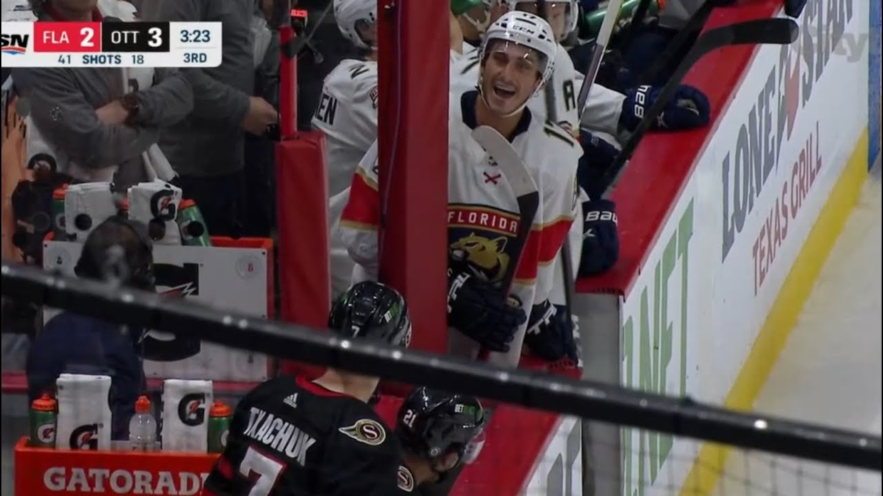 Brady Tkachuk and Mason Marchment exchanging chirps at the bench