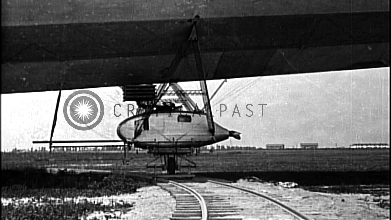 LZ-127 Graf Zeppelin in flight and LZ-126 ZR-3 airship being positioned...HD Stock Footage