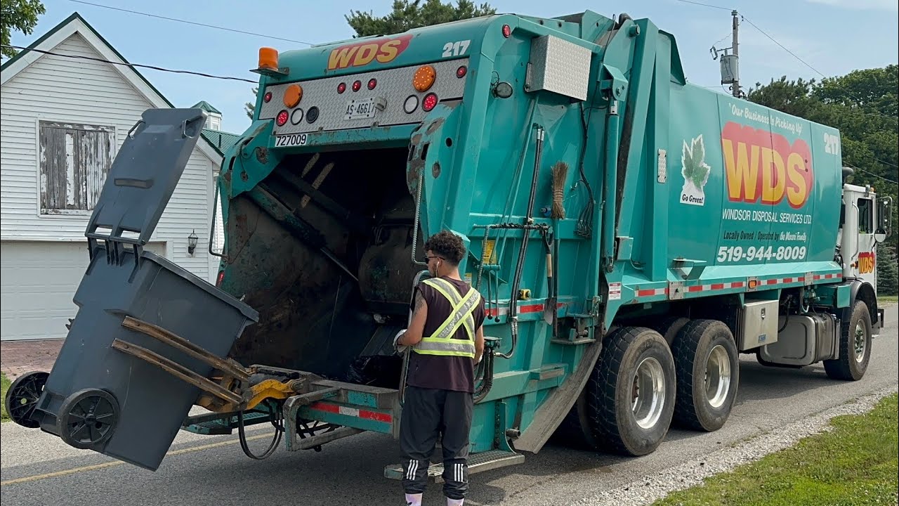 Mack Fanotech Rear Loader Garbage Truck with a Lid Flipping Gripper Tipper
