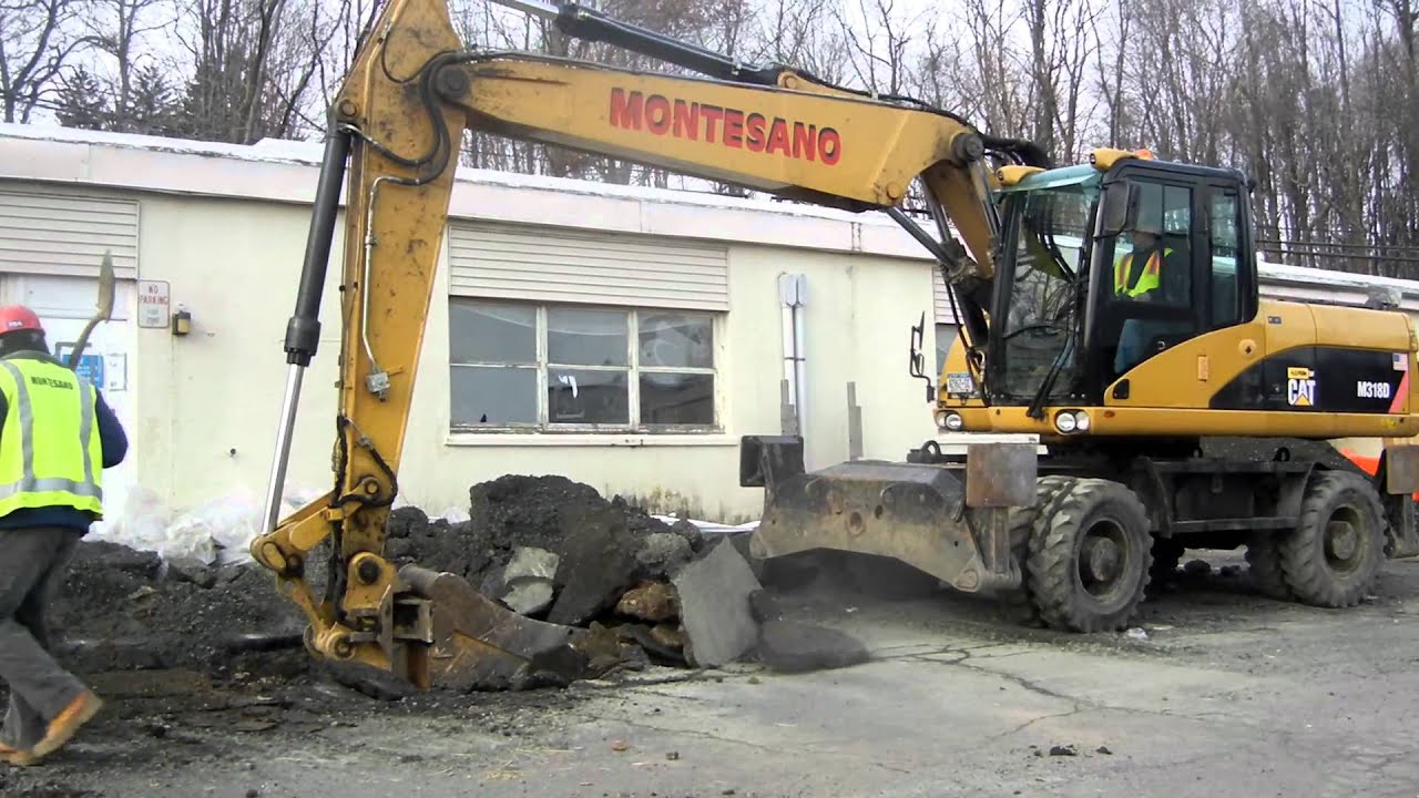 Cat M318D Loading Asphalt