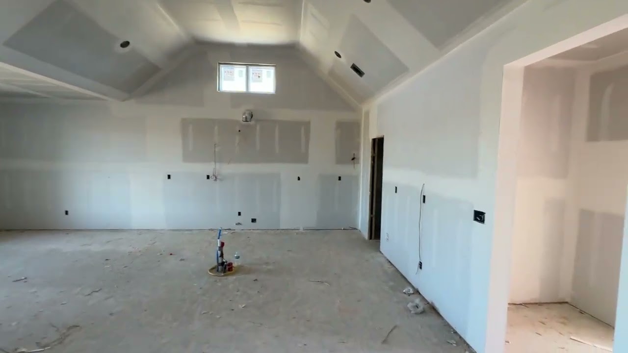 3-12-26  Brick complete and drywall close behind.