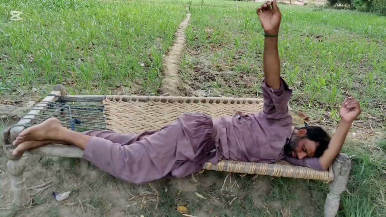How fun is this boy sleeping in the village This boy was tired of cutting the grass