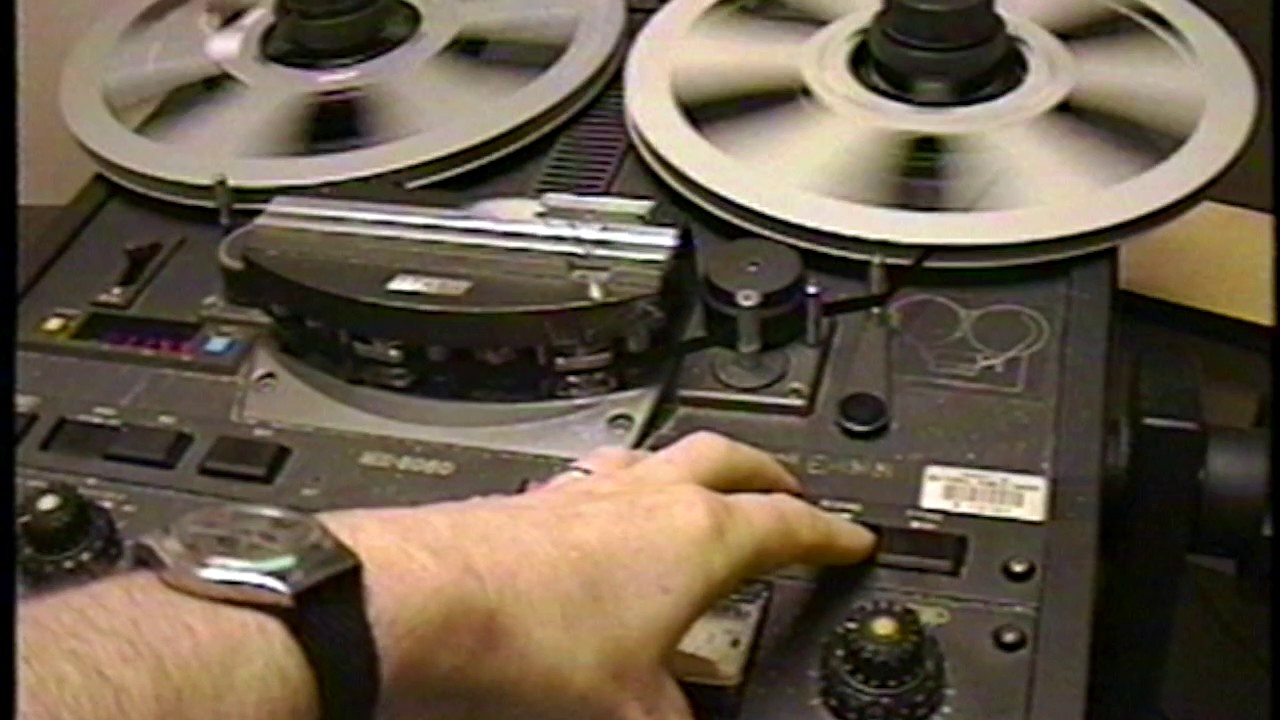 NPR Producer editing audio tape, 1995