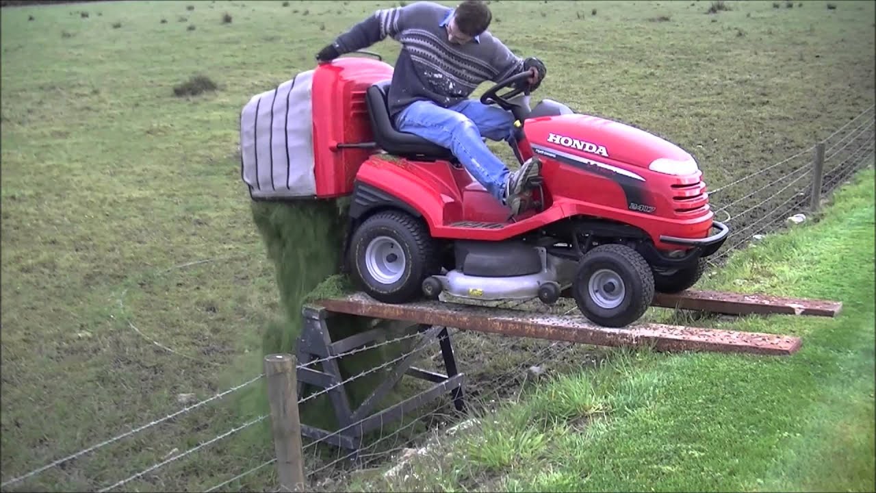HF2417 Honda empty grass box over low fence
