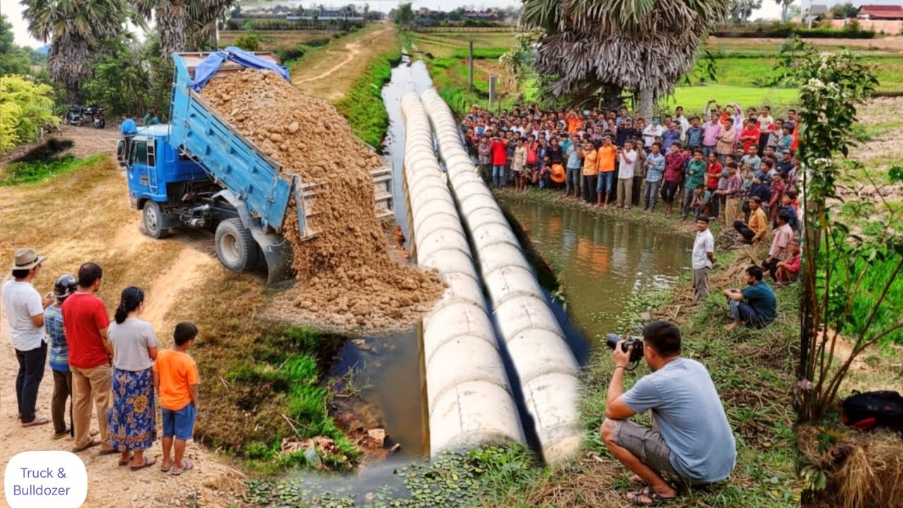 First start opening delete drainage BY Bulldozer D20P Pushing Soil & Dump Truck Unloading