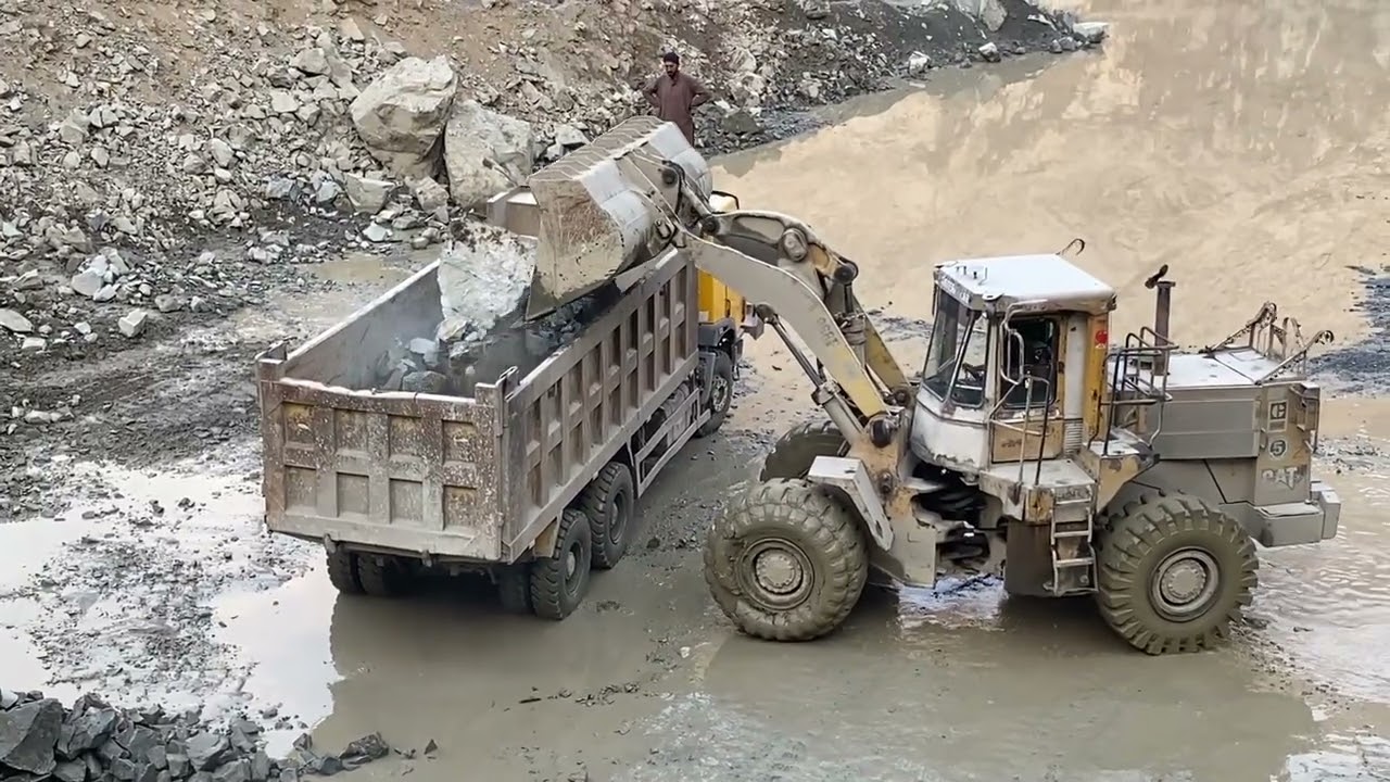 Incredible Power  Caterpillar Loading Huge Rocks into Truck