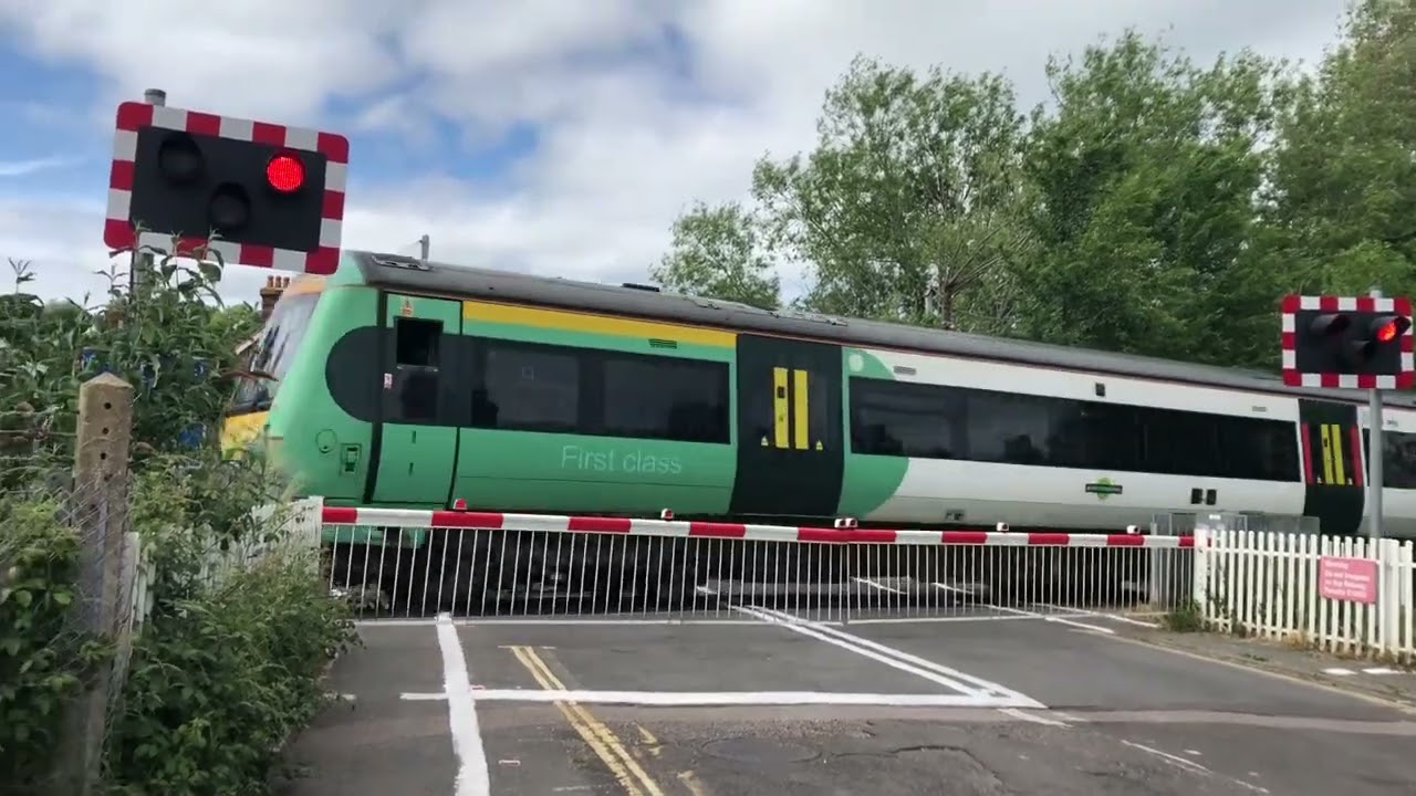 2 trains at Rye grove road level crossing East Sussex