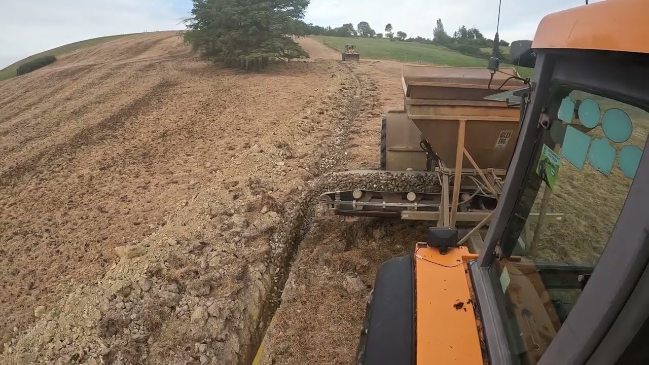 Land drainage: Filling drains with stone cart
