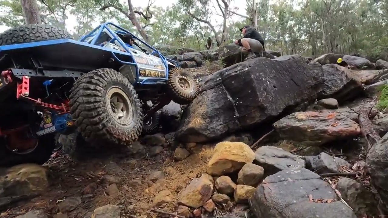 Hardcore rockcrawling LN106 Hilux Team Bullet comp truck on 40inch tyres takes on a HUGE rock garden