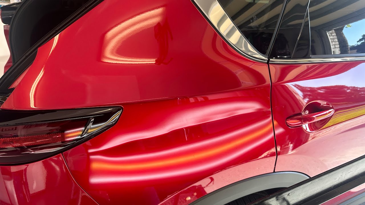 ART OF IRONING OUT DENTS WITHOUT HARMING THE PAINT