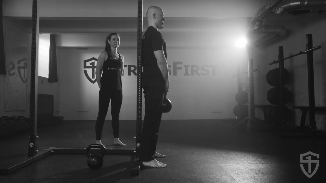 Improve Your Kettlebell Swing Lockout with the Back-to-the-Wall Plank | StrongFirst