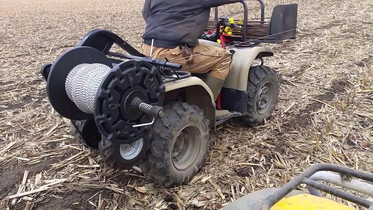 Four wheeler mounted fence winder