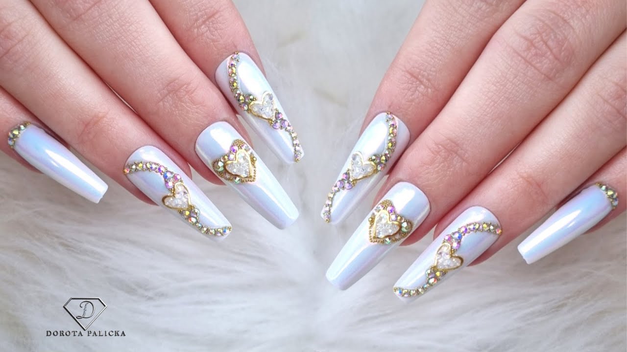 Aurora chrome nails with crystals placement amd Swarovski pixie. Crushed crystals nail art.