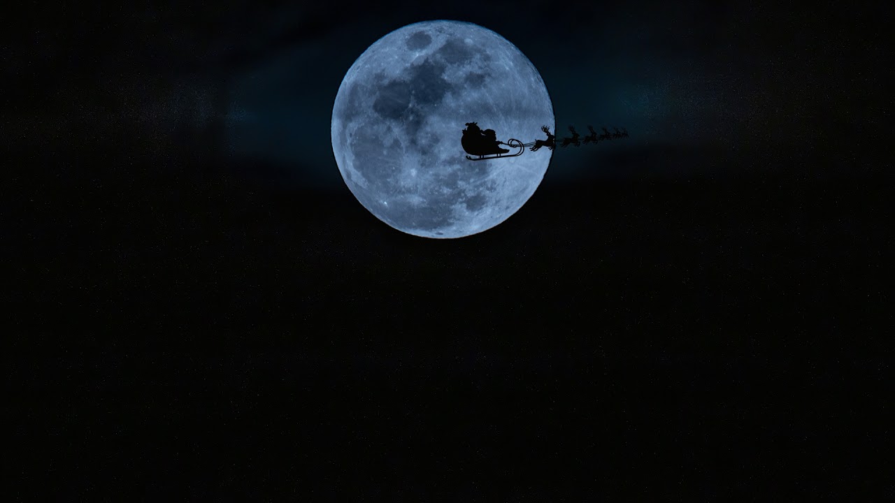 Santa flying over the moon